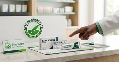 pharmacist at Citi Pharmacy explaining pain relief medicines to customer in Ghana